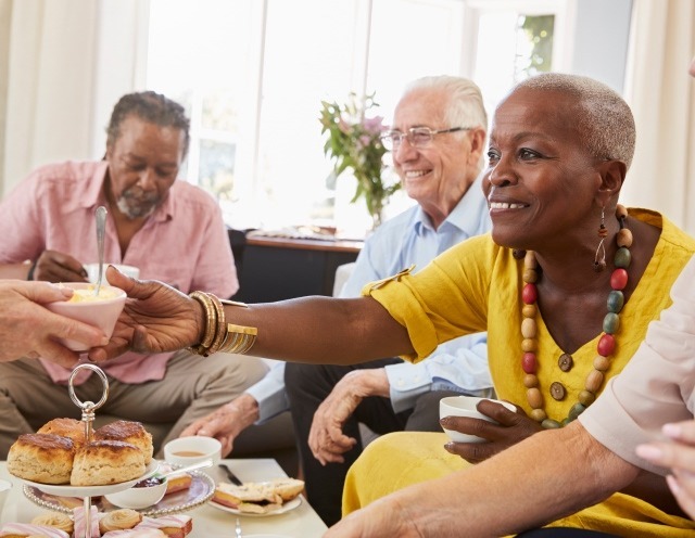 senior people sharing a meal community